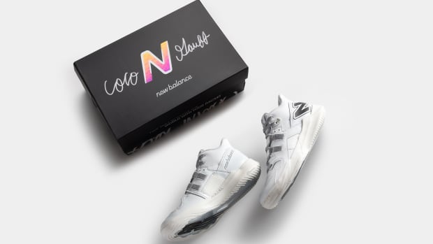 Coco Gauff's white and black New Balance tennis shoes and box.